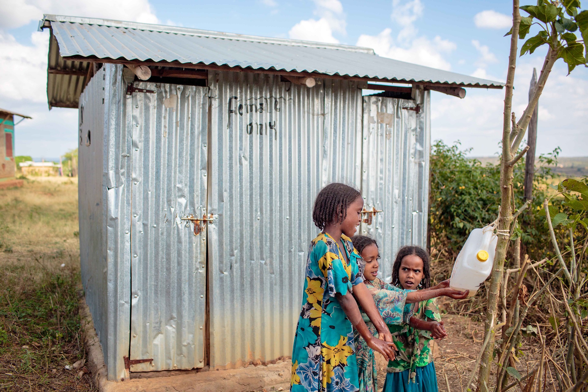washing hands at the lattrine