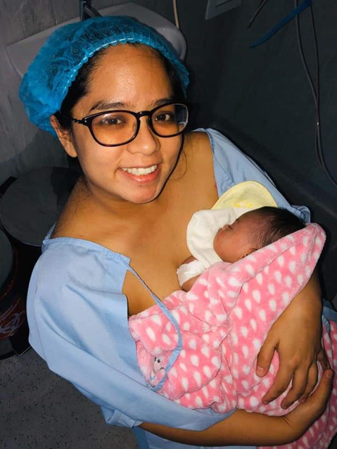 A mother and her daughter practise Kangaroo Mother Care.