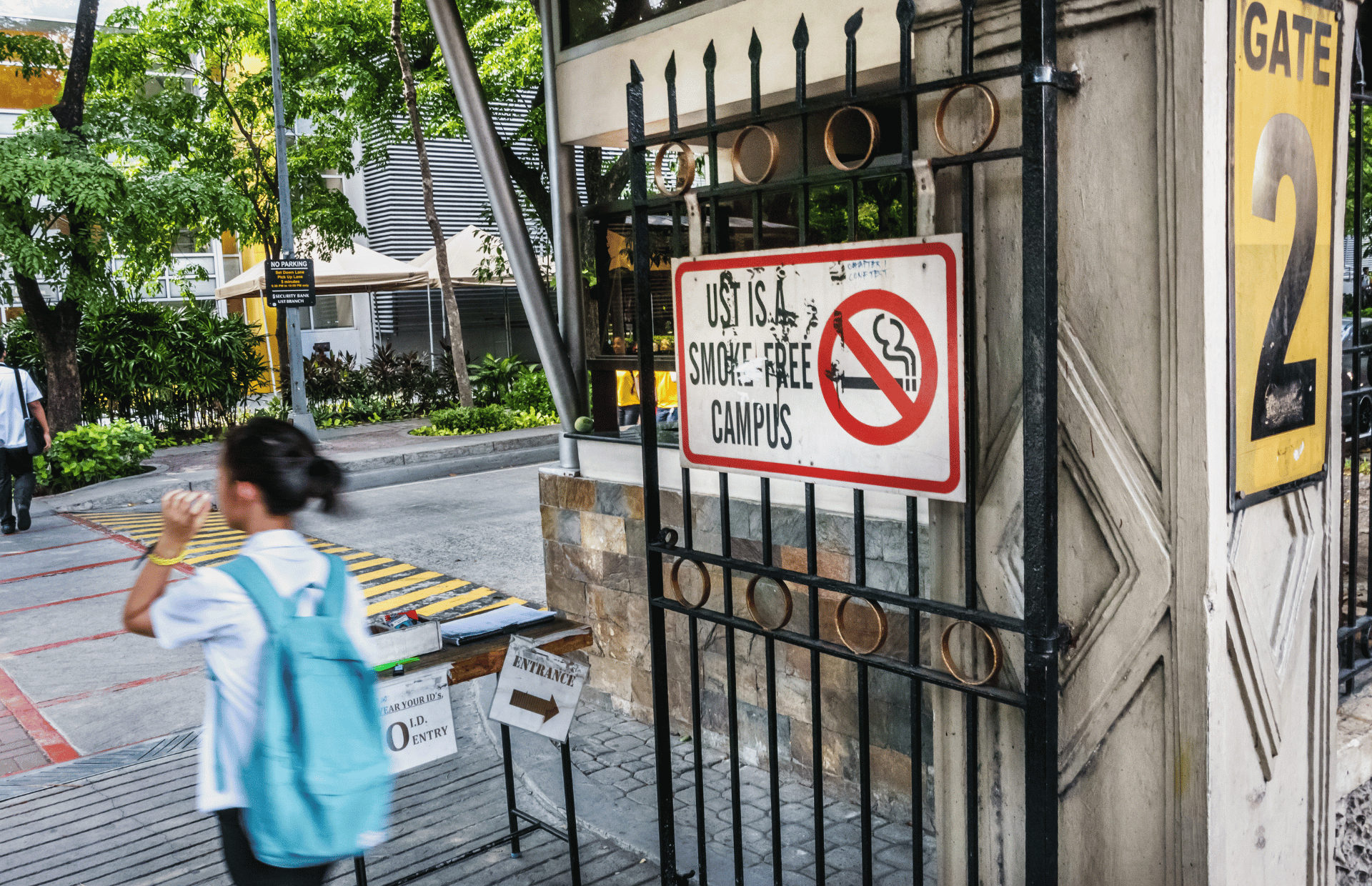 A non-smoking sign in a school campus gate.